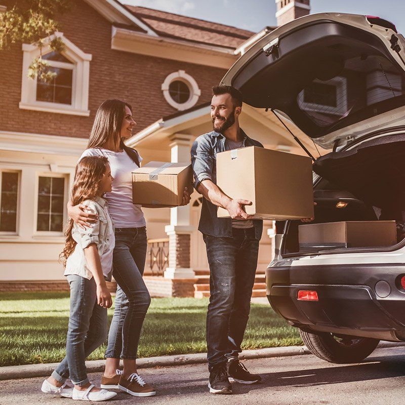Apartment Rental — Happy Family Holding their Moving Boxes in Phoenix, AZ Apartment Rental — Happy Family Holding their Moving Boxes in Phoenix, AZ
