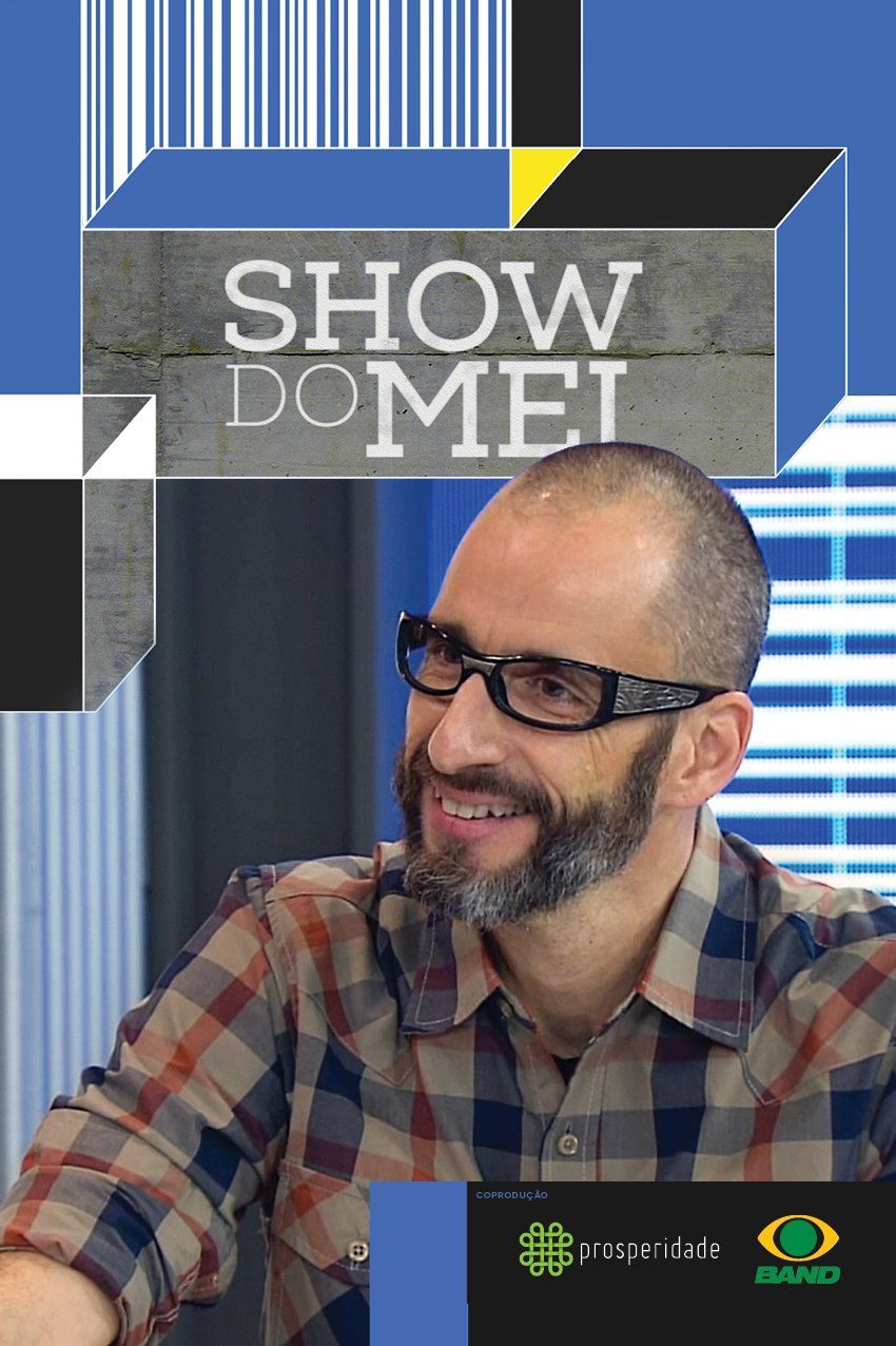 Um homem com barba e óculos está vestindo uma camisa xadrez.