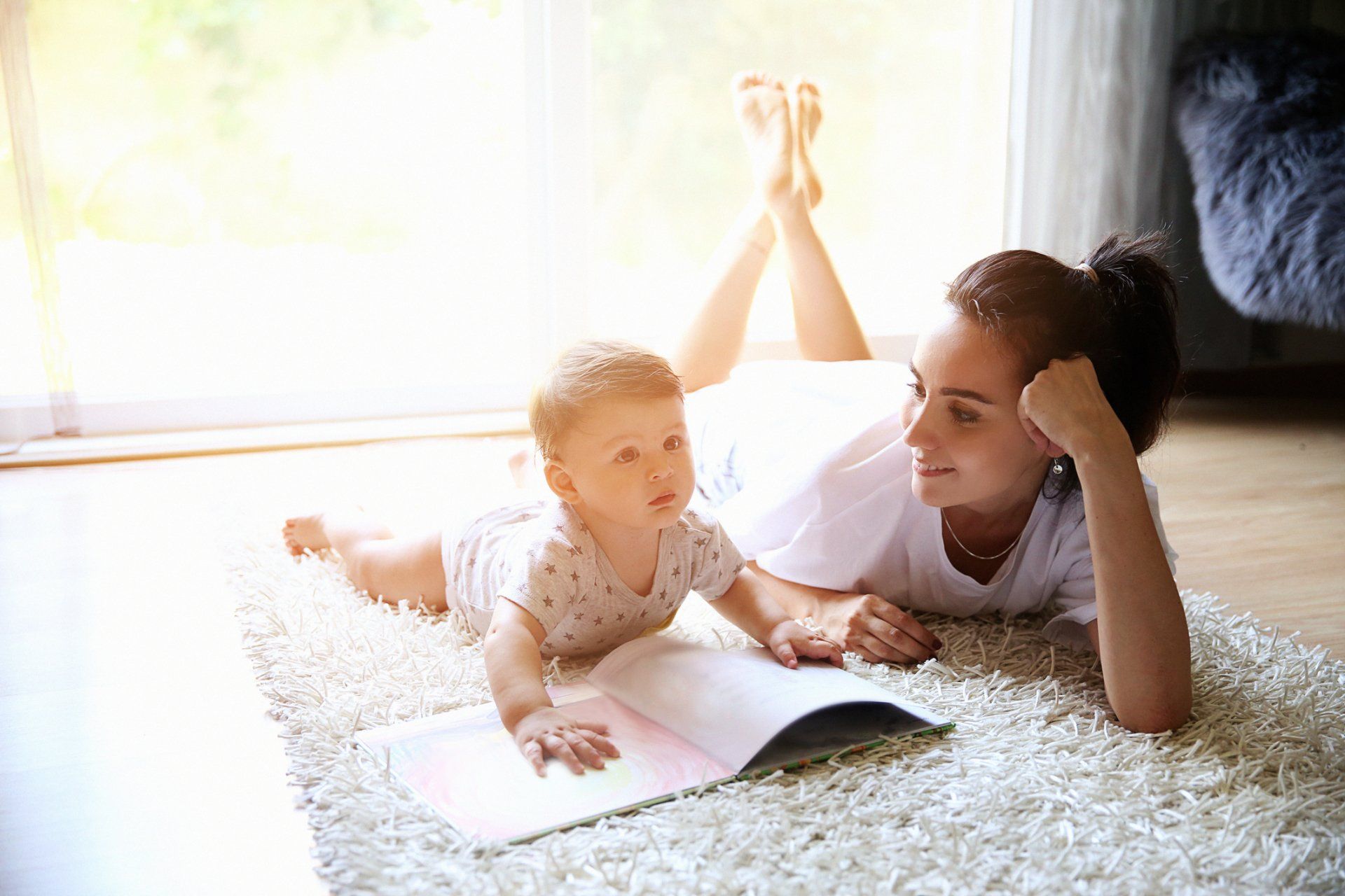 Worker Checking Commercial Air Conditioner — Raymond, MS — Mid Mississippi Heating & AC, LLC A mother and child enjoying their air conditioning installation in Clinton, MS