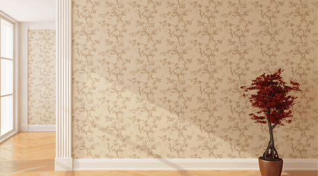 A red plant in a tub, in front of a cream wall sprigged with beige flowers