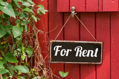 Old metal sign with the inscription For Rent