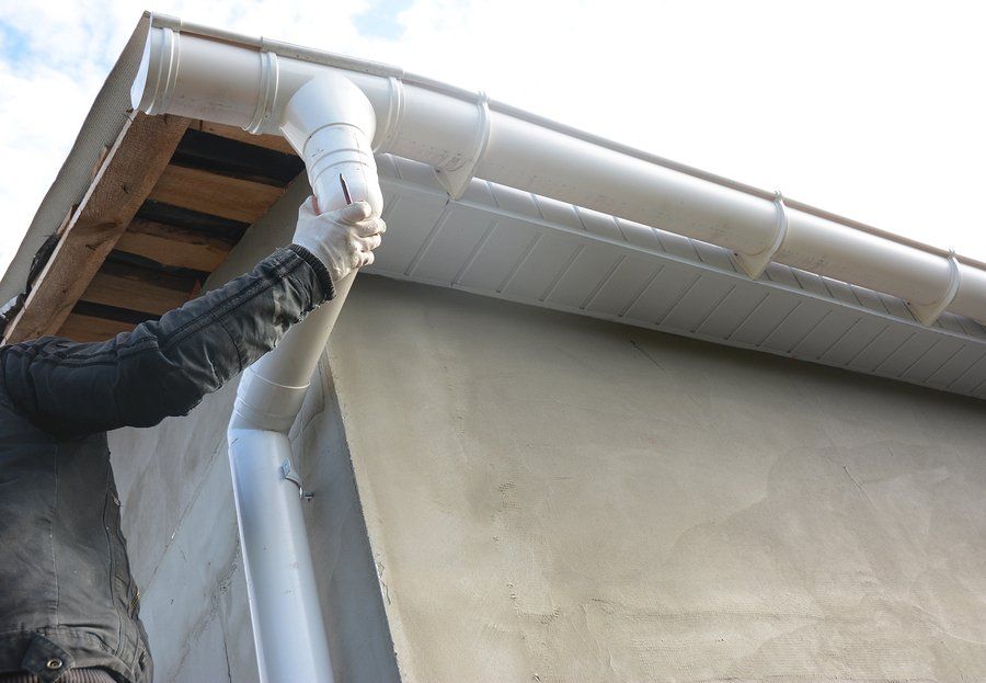 someone fixing the roof gutter