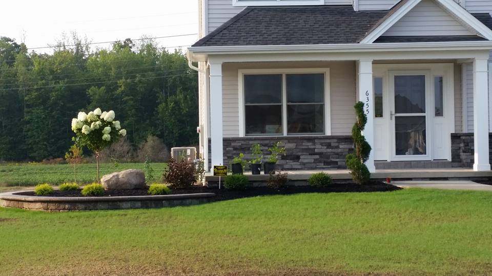 a house with a large lawn in front of it