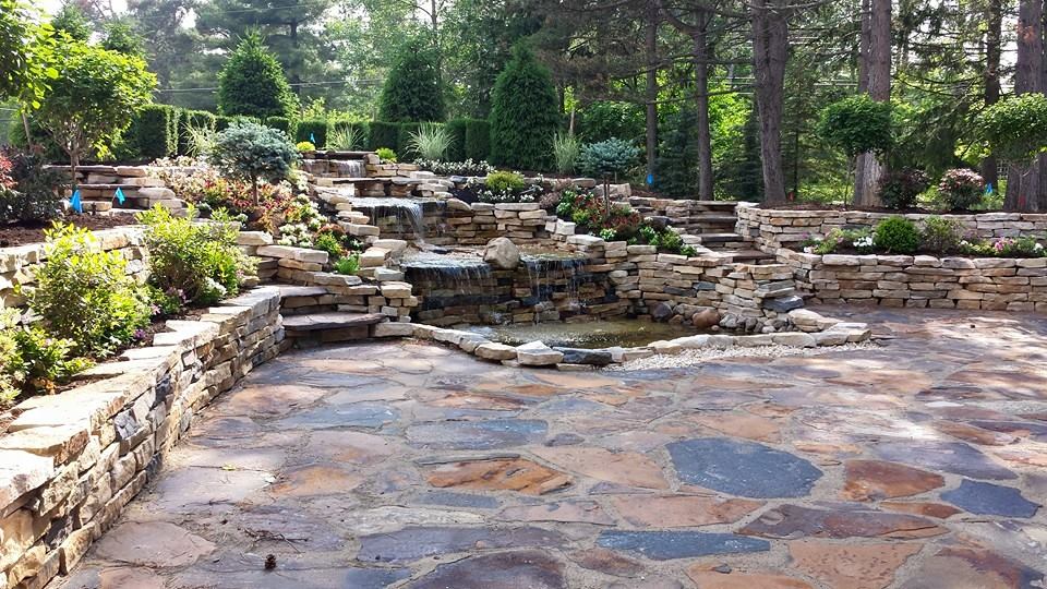 there is a waterfall in the middle of the garden .