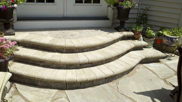 a set of stone steps leading up to a house .
