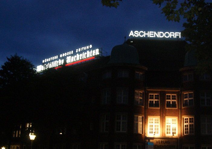 Building with illuminated signs