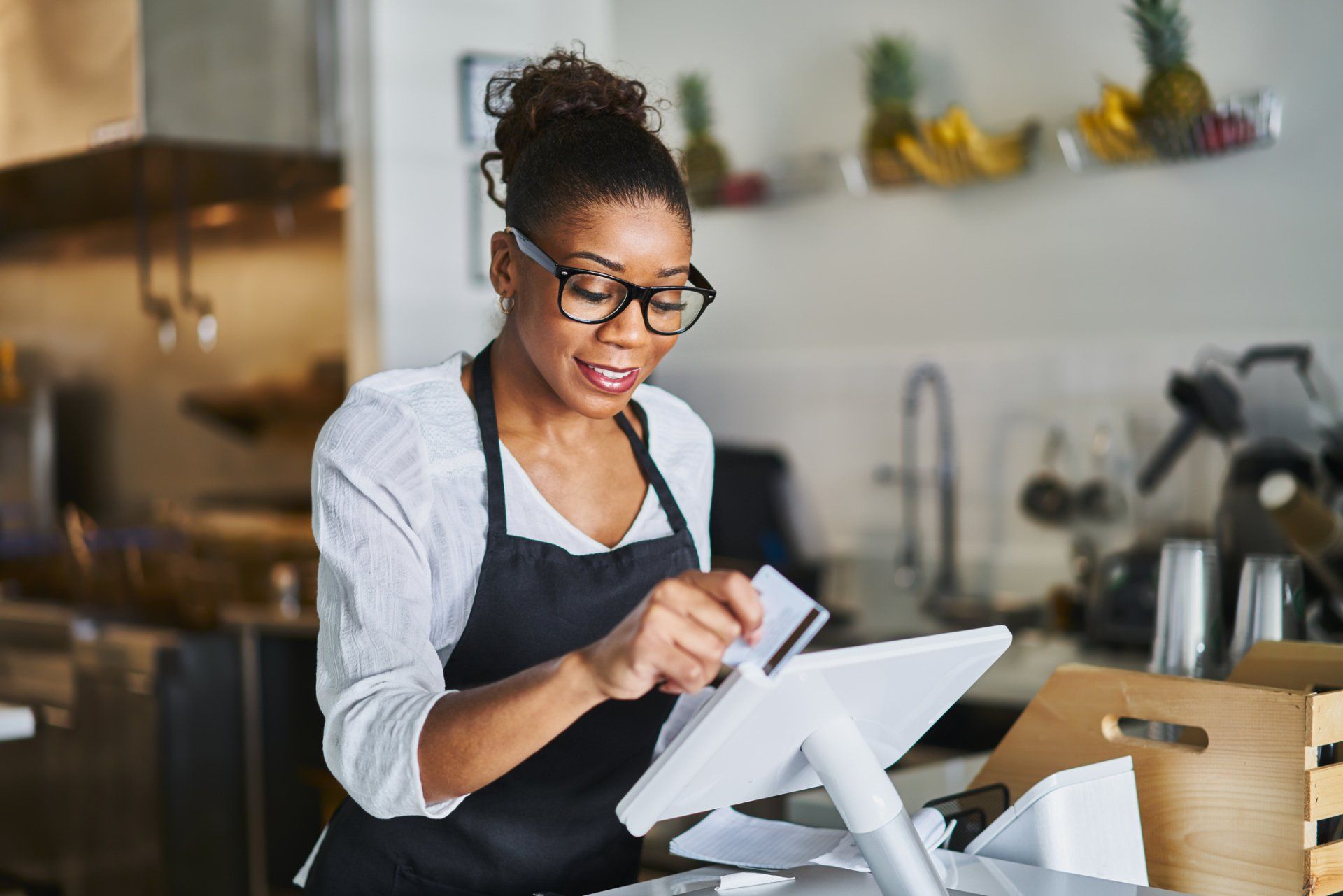 Woman Swiping Card — Orange Park, FL — Andersen Insurance Group