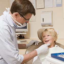 Child Getting Dental Examination Child Getting Dental Examination