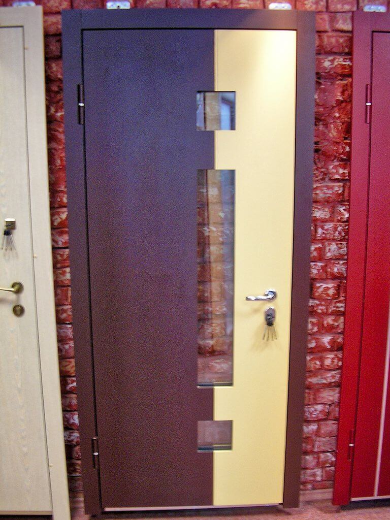 Brown and tan front door with rectangular glass inserts, set against a brick wall.