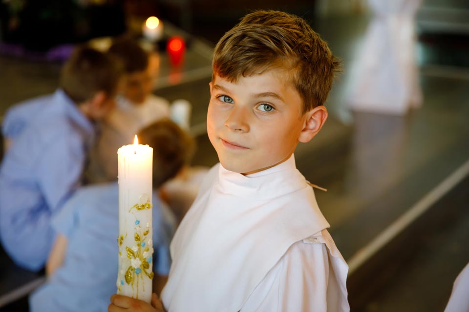 Child Holding Candle | Doylestown, PA | Our Lady of Mount Carmel