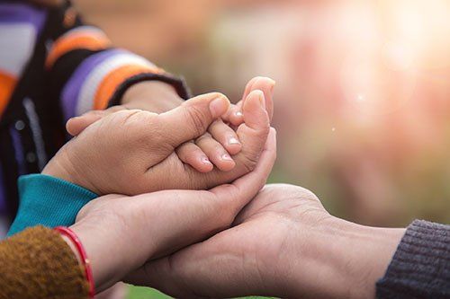 Guardianship — Baby and Parents' Hands in Massillon, OH Guardianship — Baby and Parents' Hands in Massillon, OH