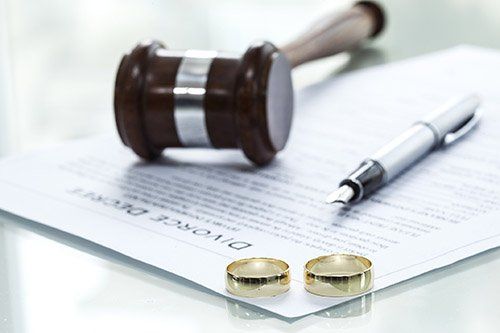 Divorce decree and rings. Divorce decree and rings.