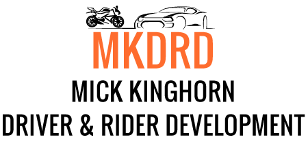 A logo for mick kinghorn driver and rider development