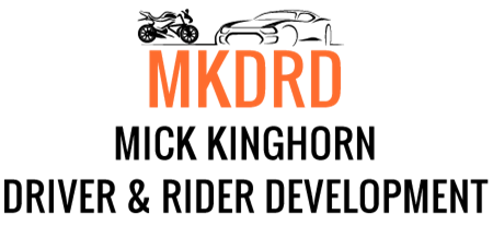 A logo for mick kinghorn driver and rider development