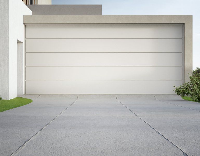 Modern House And Big Garage With Concrete Driveway — Wausau, WI — Able Concrete Raising WI, LLC A home in Stevens Point, WI, that had concrete leveling services
