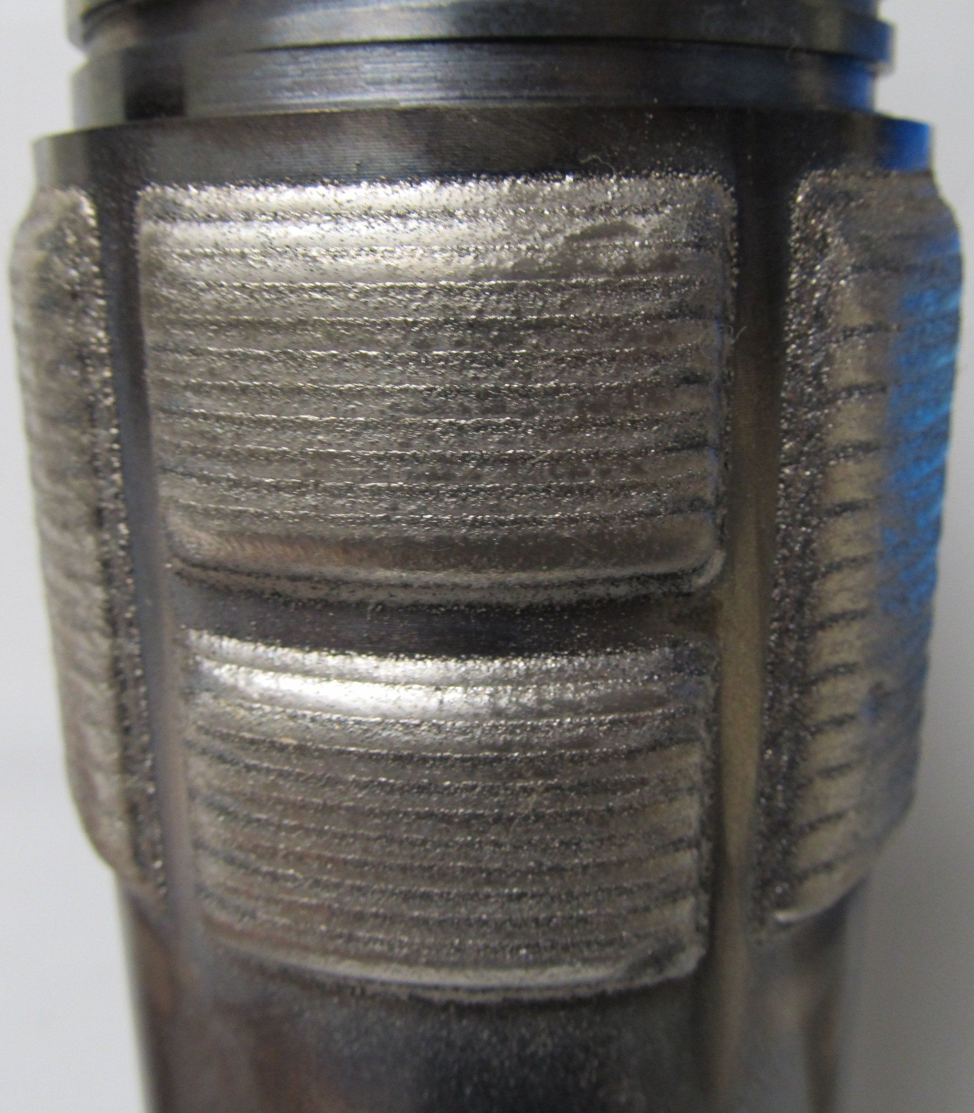 A close up of a metal object with a shiny finish