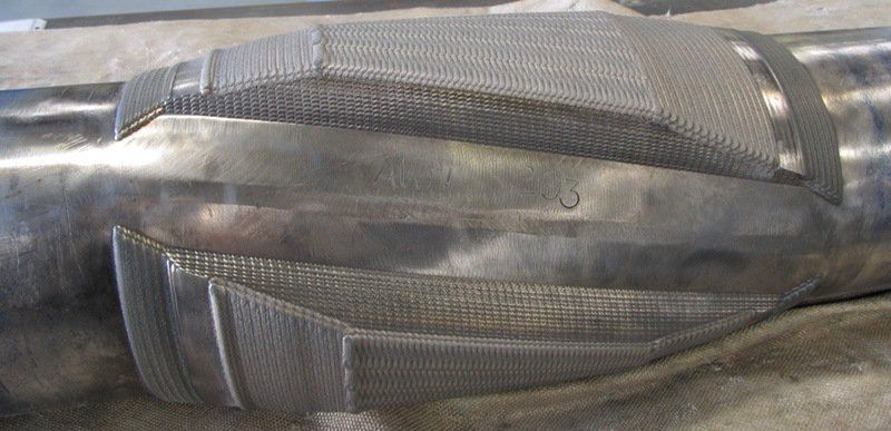 A close up of a metal object on a table.