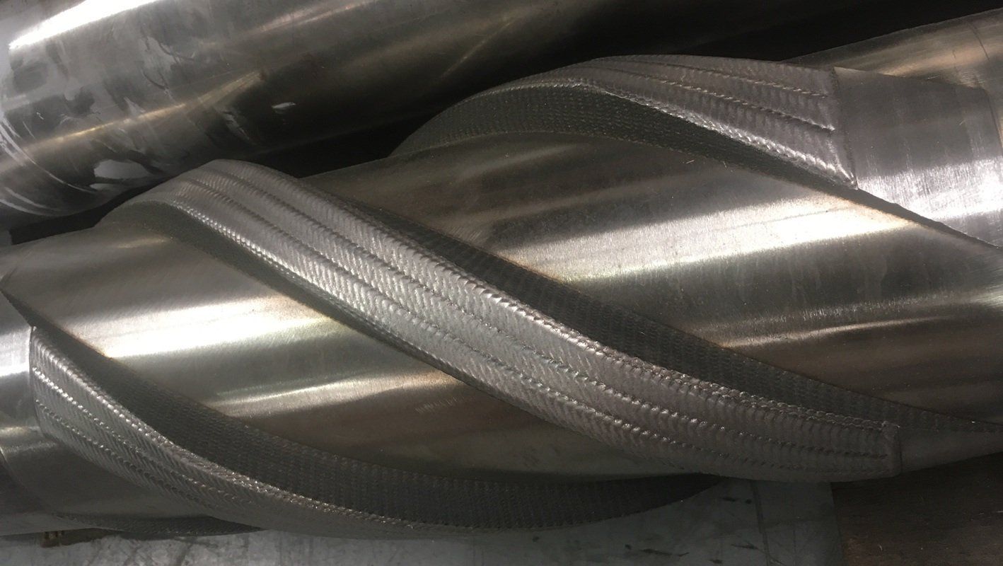 A close up of a metal pipe with a spiral pattern on it.
