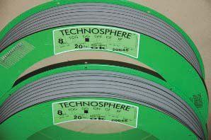 Two rolls of technosphere tape are sitting on top of each other on a table.