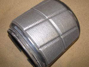 A close up of a metal object on a table.