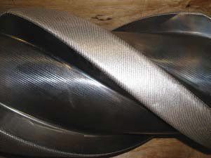 A close up of a metal object on a wooden table.