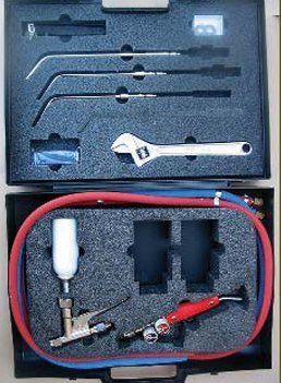 A black case filled with tools and a wrench.