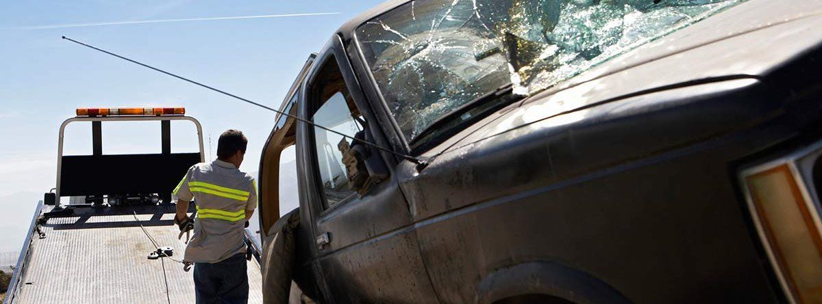 tow-truck-picking-up-a-crached-car tow-truck-picking-up-a-crached-car