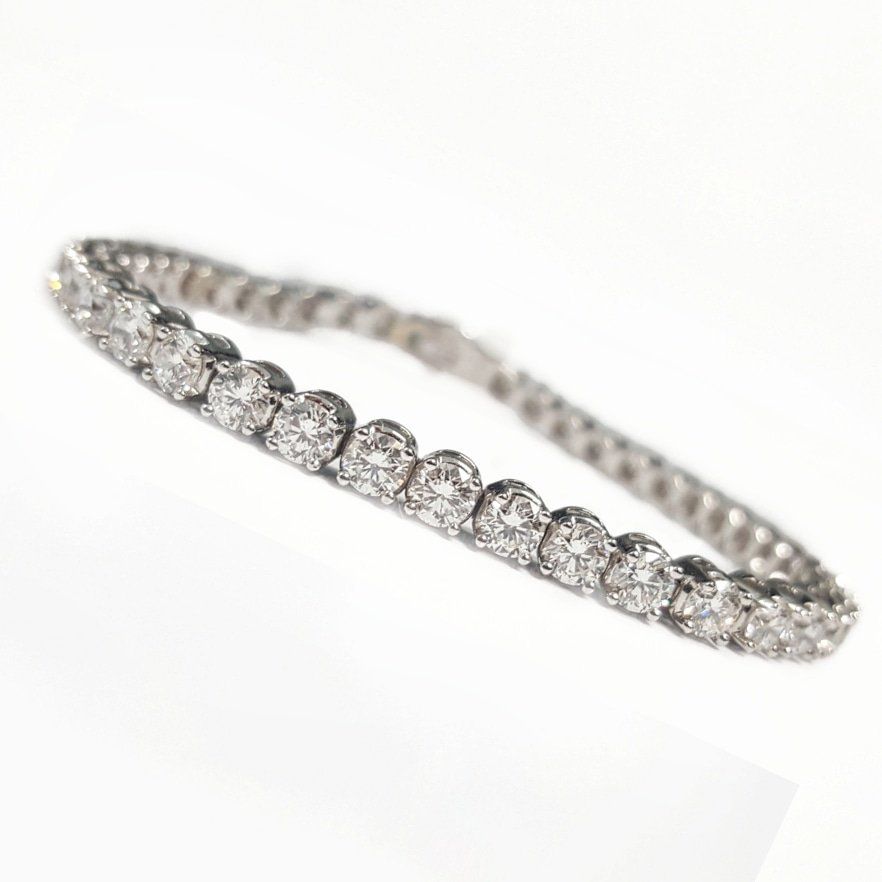 A bracelet with diamonds on a white background