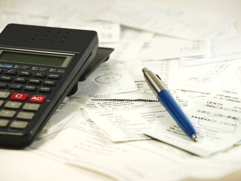 Business owners calculating their expenses in british columbia.