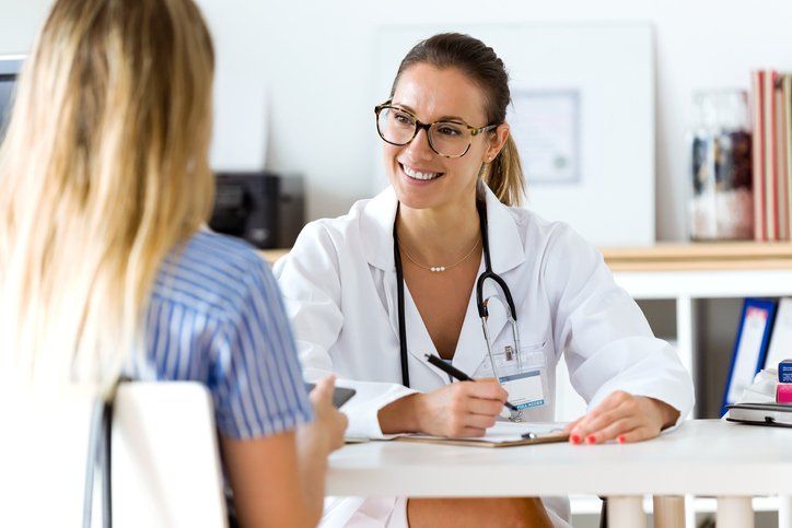 doctor talking with patient
