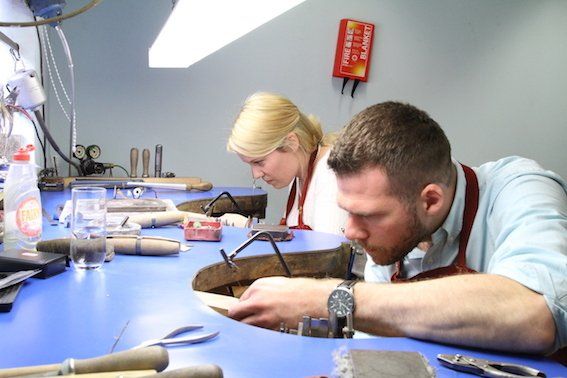 Cutting the metal to length using a piecing saw.