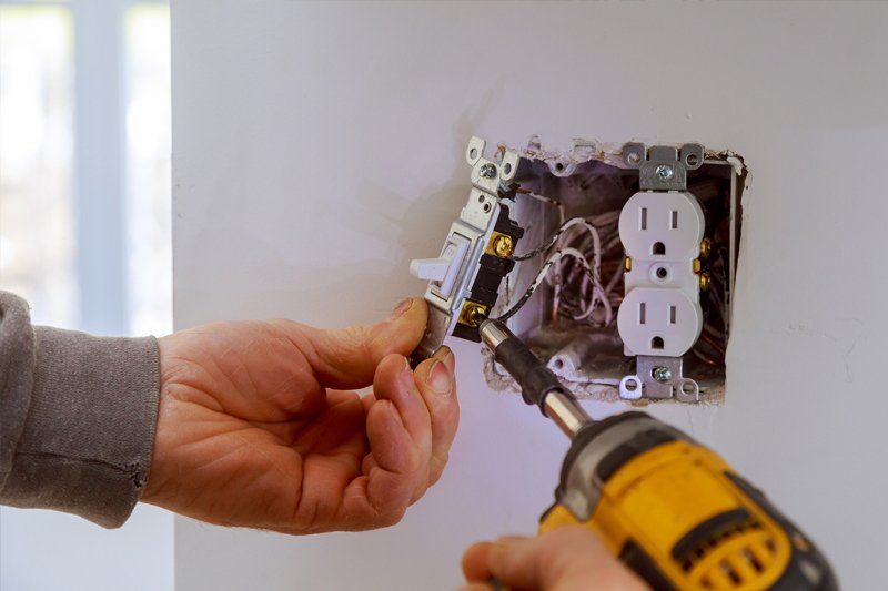Installing Electrical Outlet — Albuquerque, NM — McDonald Electric Installing Electrical Outlet — Albuquerque, NM — McDonald Electric
