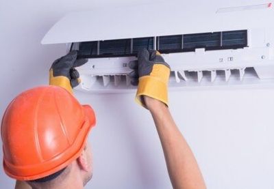 Technician performing HVAC Repair - HVAC Services in Tampa, FL Technician performing HVAC Repair - HVAC Services in Tampa, FL