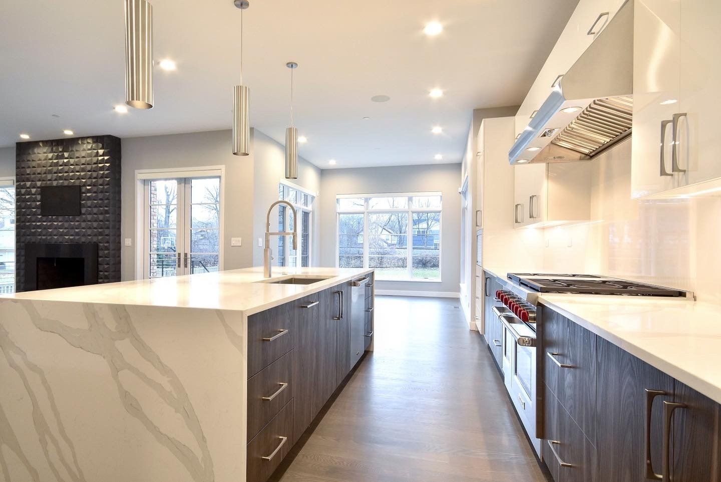 A kitchen with a large island in the middle of it.