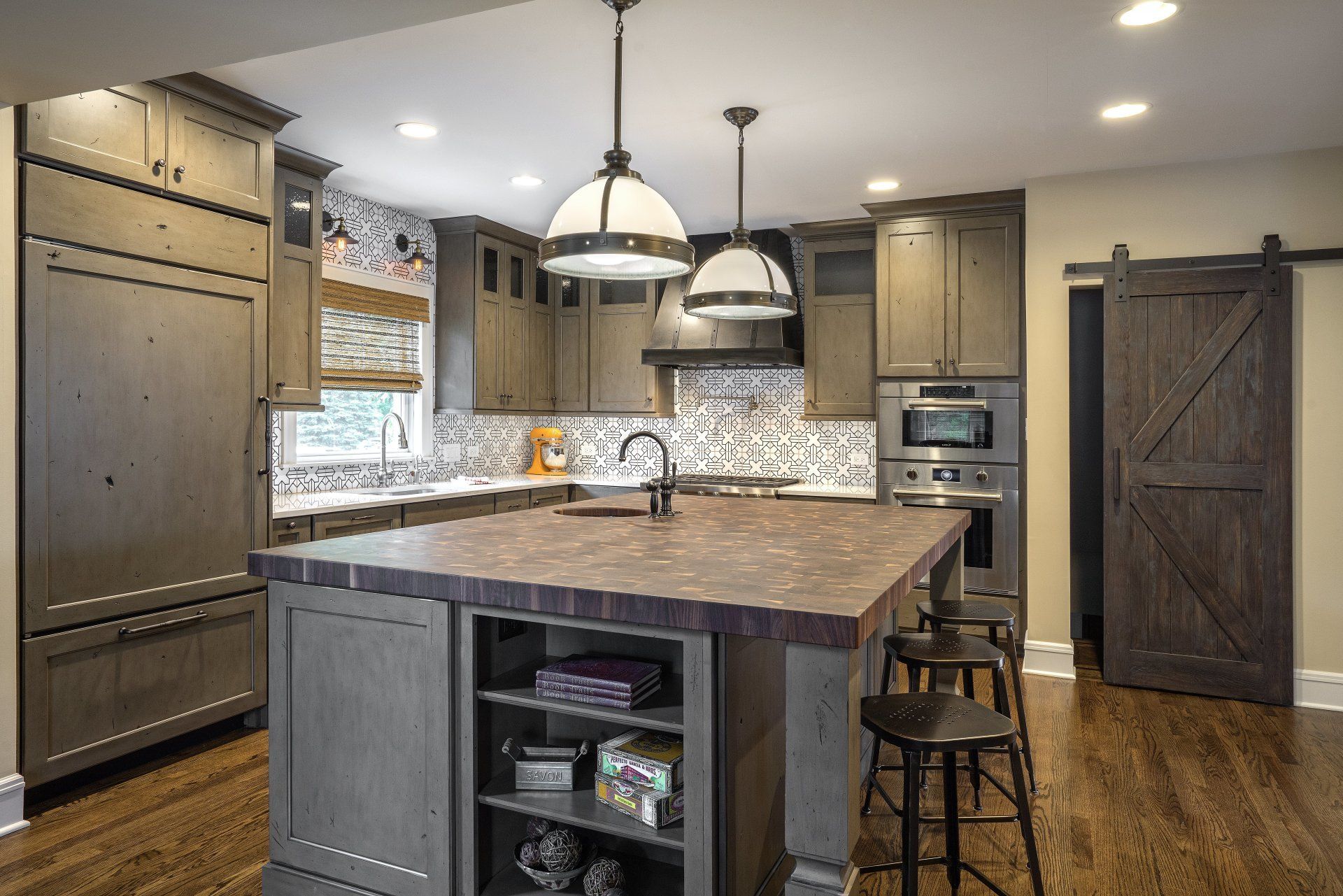 There is a large island in the middle of the kitchen.