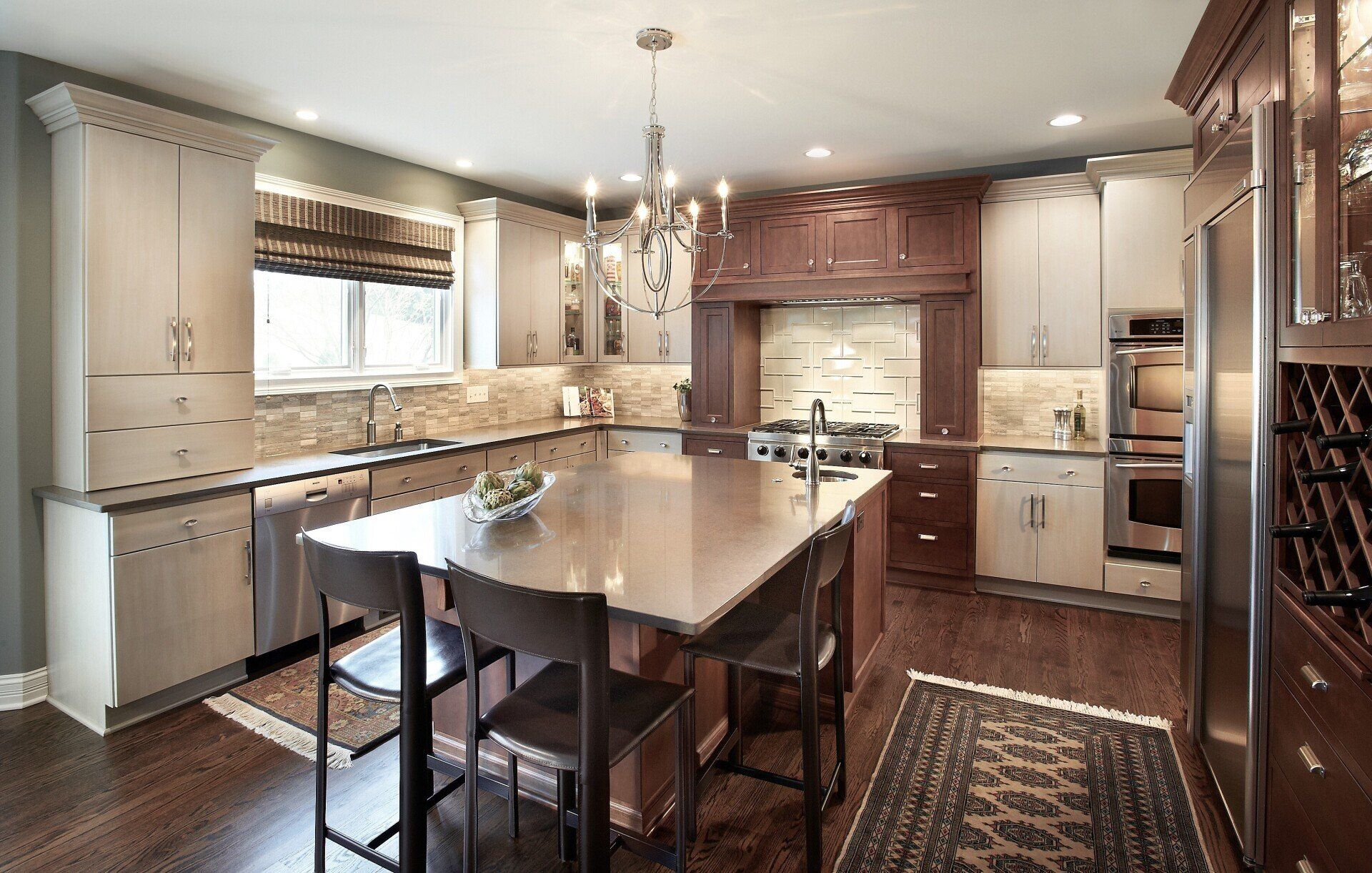 A kitchen with stainless steel appliances and a large island