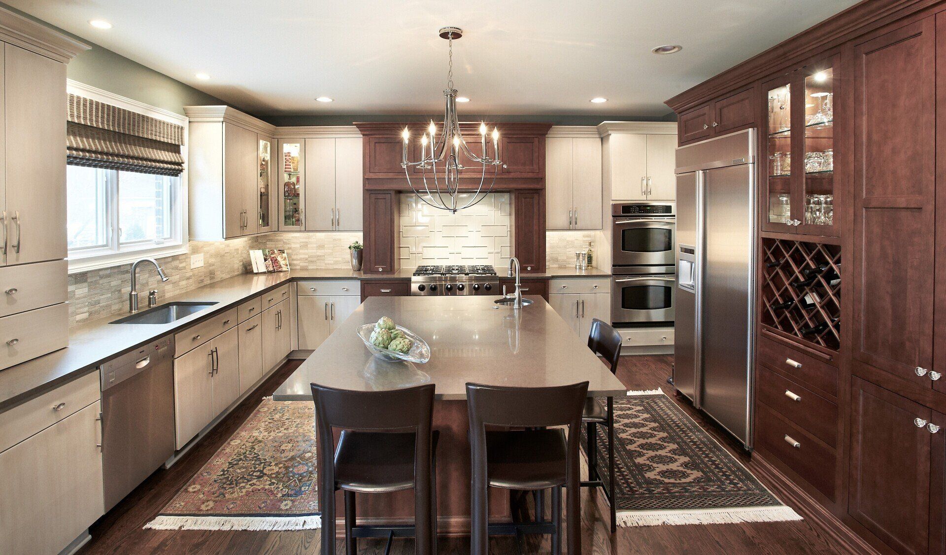 A kitchen with stainless steel appliances and a large island