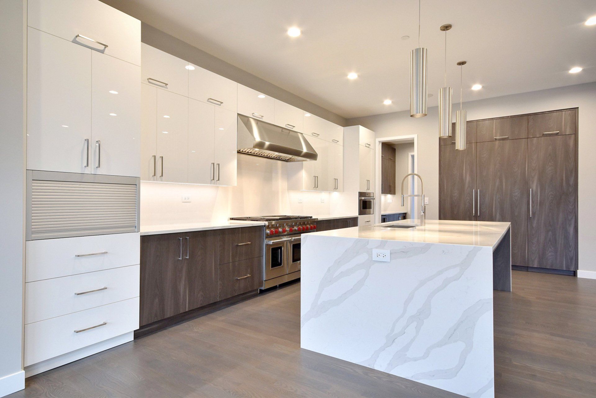 There is a large island in the middle of the kitchen.