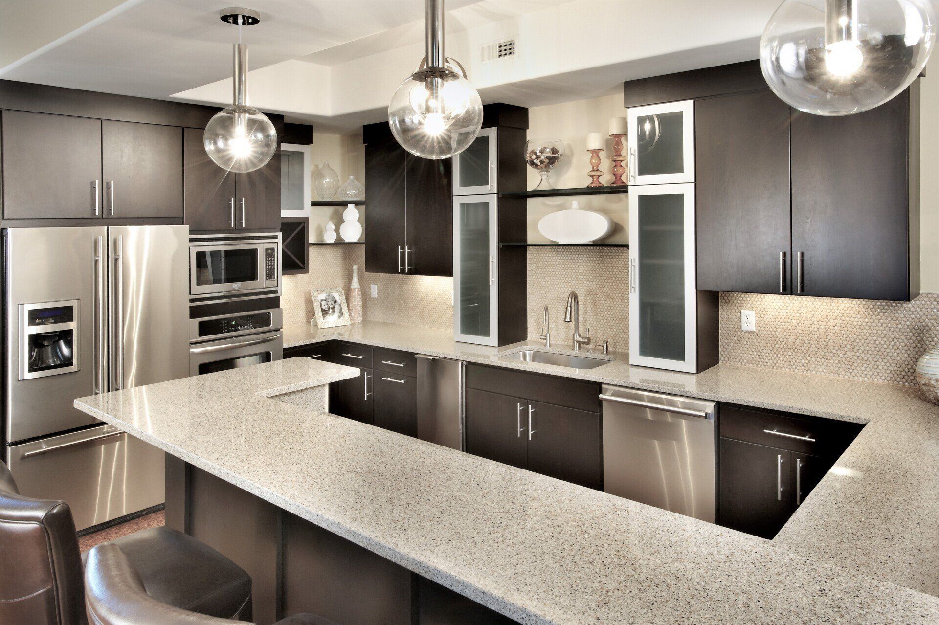 A kitchen with stainless steel appliances and granite counter tops