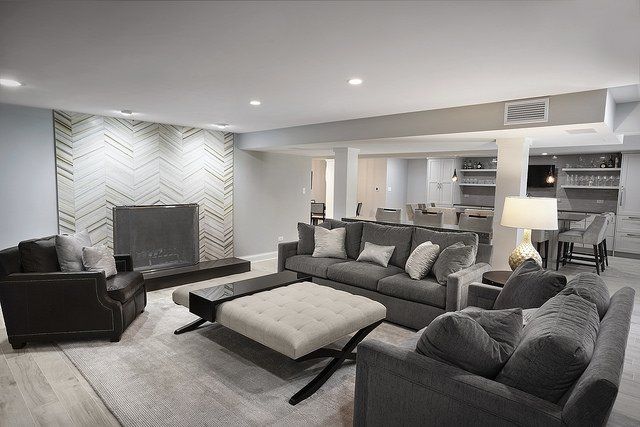 A living room filled with furniture and a fireplace.