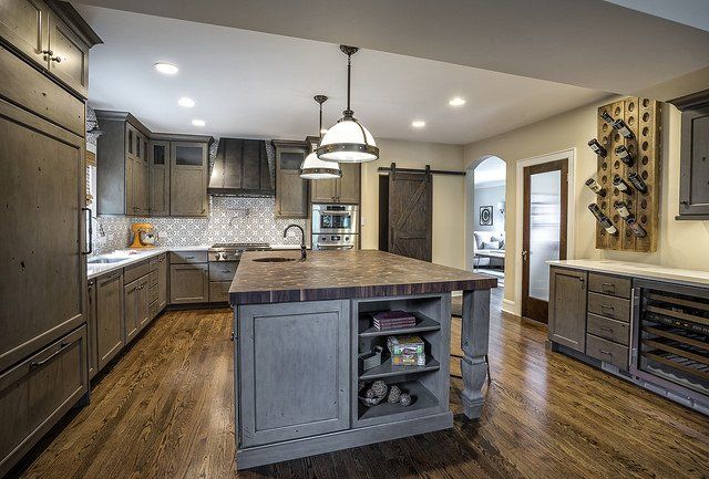 There is a large island in the middle of the kitchen.