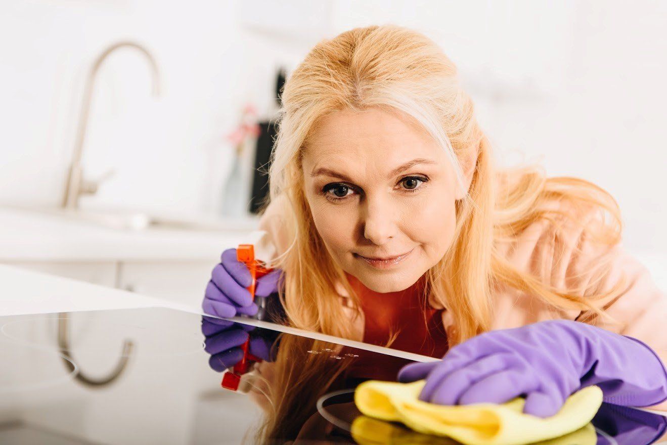 Woman Cleaning On The Kitchen — Vienna, VA — Tysons Self Storage Woman Cleaning On The Kitchen — Vienna, VA — Tysons Self Storage