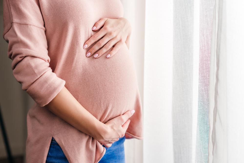Pregnant Woman Holding Her Tummy — Vienna, VA — Tysons Self Storage Pregnant Woman Holding Her Tummy — Vienna, VA — Tysons Self Storage