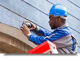 Technician installing a camera