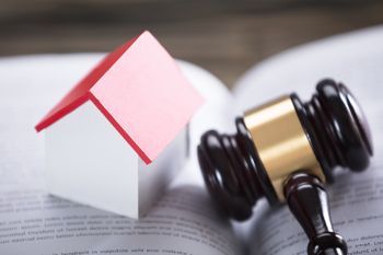 Estate Planning — House Model And Gavel On Law Book in Brighton, CO