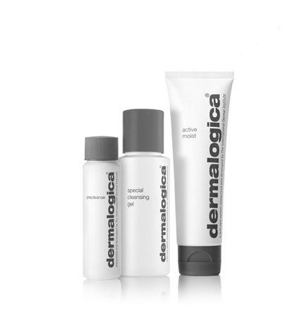 Three bottles of dermalogica products are sitting next to each other.