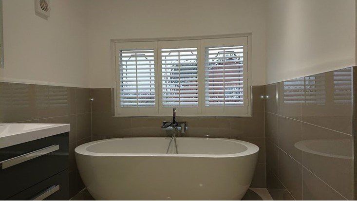Faux wood shutters