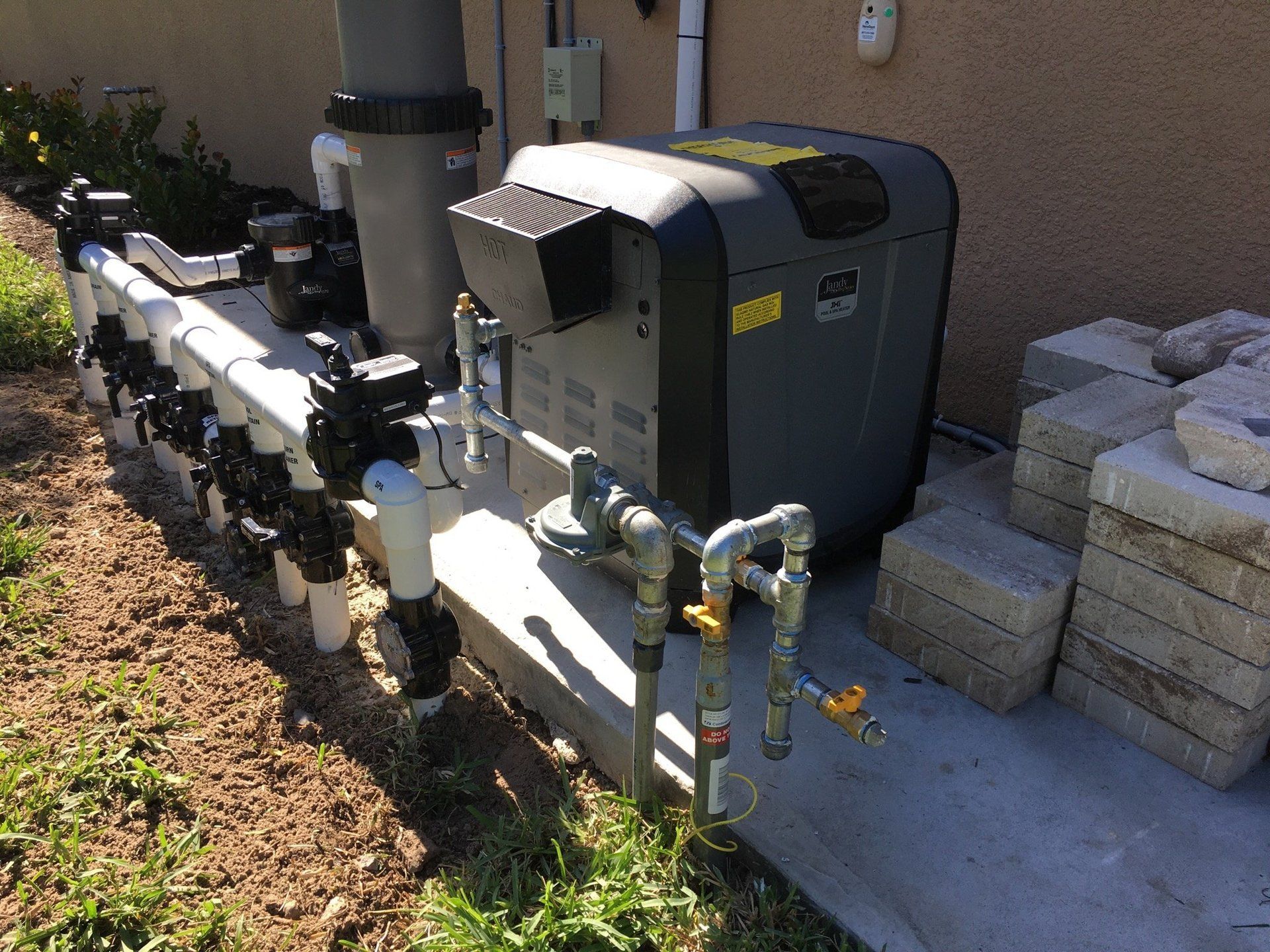 Gray Pool Heater — Naples, FL — First Class Plumbing of Florida, Inc.