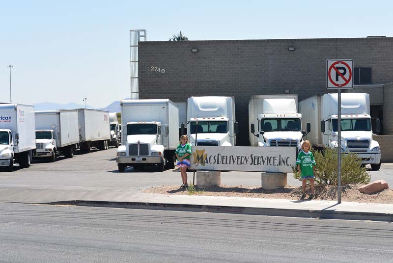 Delivery truck store front with two girls in front —Delivery Service in Las Vegas, NV