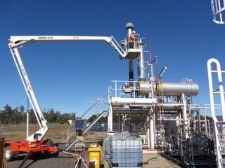 Man Checking Equipment — Gas Compliance Services in Yeppon, QLD Man Checking Equipment — Gas Compliance Services in Yeppon, QLD